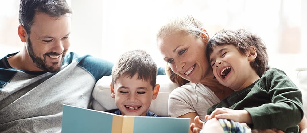 Family looking at a photo album together